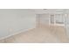 A large living room showcasing tile flooring, neutral-colored walls, and multiple doorways for open-concept living at 7108 14Th Nw Ave, Bradenton, FL 34209