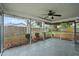 Covered, screened in porch with a ceiling fan and views of the backyard at 7108 14Th Nw Ave, Bradenton, FL 34209