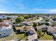 Aerial view of a residential property with a well-maintained lawn and mature palm trees at 7619 Limington Dr, Port Richey, FL 34668