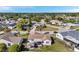 Aerial view showcasing a home's backyard with a wooden gazebo and screened lanai at 7619 Limington Dr, Port Richey, FL 34668