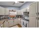 Well-equipped kitchen with white appliances and ample storage space at 7619 Limington Dr, Port Richey, FL 34668