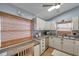 Functional kitchen featuring stainless steel appliances and ample counter space at 7619 Limington Dr, Port Richey, FL 34668