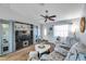 Spacious living area with modern entertainment center, neutral decor, and ample natural light at 7619 Limington Dr, Port Richey, FL 34668
