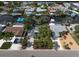 Aerial view of the waterfront property with lush landscaping and canal access at 911 Sago Palm Way Way, Apollo Beach, FL 33572