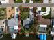 Aerial view of waterfront property bordered in red with pool, boat dock, and mature landscaping at 911 Sago Palm Way Way, Apollo Beach, FL 33572
