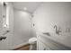Modern bathroom featuring a tiled shower, wooden floors, and white vanity at 911 Sago Palm Way Way, Apollo Beach, FL 33572