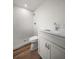 Bathroom featuring a tiled shower, wooden floors, and a white vanity at 911 Sago Palm Way Way, Apollo Beach, FL 33572