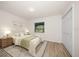 Cozy bedroom featuring a comfortable bed, soft lighting, and a window overlooking the outdoors at 911 Sago Palm Way Way, Apollo Beach, FL 33572