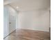 Bright entryway featuring wood-look floors, white walls, and a front door with glass at 911 Sago Palm Way Way, Apollo Beach, FL 33572