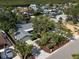 An exterior view of a lovely waterfront home with palm trees and mature landscaping at 911 Sago Palm Way Way, Apollo Beach, FL 33572