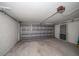 Garage with a roll-up metal door, access door and gray painted walls at 911 Sago Palm Way Way, Apollo Beach, FL 33572