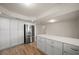 Bright kitchen featuring white cabinets, quartz countertops, stainless steel appliances, and an island at 911 Sago Palm Way Way, Apollo Beach, FL 33572