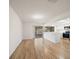 Open-concept living space featuring gorgeous flooring, and connecting to an updated kitchen with stainless appliances at 911 Sago Palm Way Way, Apollo Beach, FL 33572