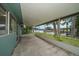 Covered patio overlooking the water, offering a serene outdoor space for relaxation at 911 Sago Palm Way Way, Apollo Beach, FL 33572