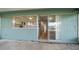 Covered patio with sliding glass doors leading to an updated kitchen with views to the outdoors at 911 Sago Palm Way Way, Apollo Beach, FL 33572