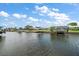 Waterfront views showcasing the peaceful canal with multiple docks for boats and outdoor activities at 911 Sago Palm Way Way, Apollo Beach, FL 33572
