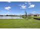 Expansive backyard with a tranquil pond view, perfect for relaxation and outdoor enjoyment at 15003 Rider Pass Dr, Lithia, FL 33547