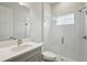 Bright bathroom with a white vanity, quartz countertop, and a glass-enclosed shower, offering a clean and modern aesthetic at 15003 Rider Pass Dr, Lithia, FL 33547