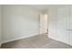 Spacious bedroom featuring neutral carpet, base molding, and a closet, providing a blank canvas for personalization at 15003 Rider Pass Dr, Lithia, FL 33547