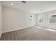 Bright bedroom featuring neutral carpet and natural light from multiple windows, creating a comfortable and inviting space at 15003 Rider Pass Dr, Lithia, FL 33547