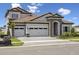 Charming home featuring a two-car garage and stone architectural details at 15003 Rider Pass Dr, Lithia, FL 33547