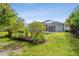 Lawn with trees, plants and mulch ground cover, backyard at 15209 Hammock Chase Ct, Odessa, FL 33556