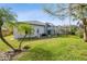 Lawn and house with enclosed pool in backyard at 15209 Hammock Chase Ct, Odessa, FL 33556
