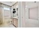 Bathroom featuring a tub shower combo and a single sink vanity with decorative accents at 15209 Hammock Chase Ct, Odessa, FL 33556