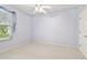 Light and airy bedroom with neutral carpet and a window, offering ample natural light at 15209 Hammock Chase Ct, Odessa, FL 33556