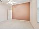 A carpeted bedroom features a neutral color palette, closet, and bright natural light at 15209 Hammock Chase Ct, Odessa, FL 33556