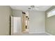 Large main bedroom with neutral walls, carpet, and view into hallway with ensuite bathroom access at 15209 Hammock Chase Ct, Odessa, FL 33556