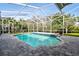 Enclosed pool with brick floor and steps to sit and relax at 15209 Hammock Chase Ct, Odessa, FL 33556
