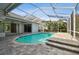 Enclosed pool with brick floor and steps to sit and relax at 15209 Hammock Chase Ct, Odessa, FL 33556