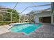 Enclosed pool with brick floor and steps to sit and relax, house in the background at 15209 Hammock Chase Ct, Odessa, FL 33556