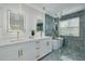 Modern bathroom featuring double vanities, contemporary fixtures, a glass-enclosed shower, and a soaking tub at 2908 Longbrooke Way, Clearwater, FL 33760