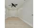 Empty bedroom with light wood floors, ceiling fan, closet, and a bright window at 2908 Longbrooke Way, Clearwater, FL 33760
