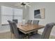 Modern dining room with a stylish light fixture and a view of the landscaped outdoors at 2908 Longbrooke Way, Clearwater, FL 33760