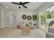 Inviting living room featuring a sliding glass doors, a neutral color palette, and views of the outdoor deck at 2908 Longbrooke Way, Clearwater, FL 33760