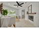 Cozy living room with a fireplace, sliding glass doors, a neutral color palette and stylish decor at 2908 Longbrooke Way, Clearwater, FL 33760