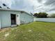 Spacious backyard features a well-maintained lawn and a privacy fence, perfect for outdoor enjoyment at 2927 W Henry Ave, Tampa, FL 33614