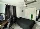 Cozy bedroom with a ceiling fan, closet, and tiled floors provides a comfortable retreat at 2927 W Henry Ave, Tampa, FL 33614