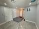 A clean, well-lit bedroom with tile flooring and neutral walls provides a versatile space for relaxation or activities at 2927 W Henry Ave, Tampa, FL 33614