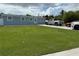 Single story house with well kept lawn, and concrete driveway at 2927 W Henry Ave, Tampa, FL 33614