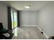 Inviting living room with sliding glass doors, offering plenty of natural light and access to the outdoors at 2927 W Henry Ave, Tampa, FL 33614