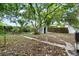 Spacious backyard with a shed, mature trees, and lush landscaping at 3105 N 16Th St, Tampa, FL 33605