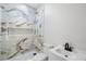 This bathroom is equipped with new marble, a toilet, a sink, and a shower at 3105 N 16Th St, Tampa, FL 33605