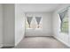 Cozy bedroom with neutral carpet, wainscoting, and soft window treatments for a tranquil retreat at 3105 N 16Th St, Tampa, FL 33605