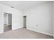 This carpeted bedroom has two doorways and a closet for storage at 3105 N 16Th St, Tampa, FL 33605