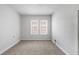 This carpeted bedroom has a large window that lets in plenty of natural light at 3105 N 16Th St, Tampa, FL 33605