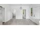 Open dining area with neutral tile, pendant lighting, and natural light at 3105 N 16Th St, Tampa, FL 33605
